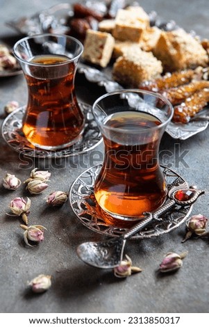 Turkish  tea  served with Turkish Delight, selective focus with shallow depth of field