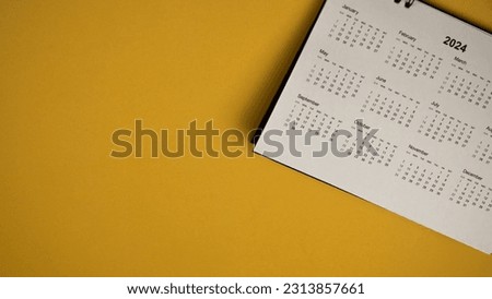 Calendar year 2024 schedule on yellow background.
2024 calendar planning appointment meeting concept. 
copy space.
top view.