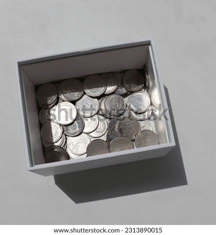 Square Photo Of Cardboard Money Box With Scattered Ukrainian Coins With Different Denomination 
