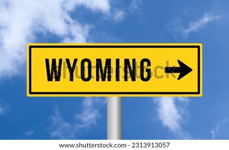 Wyoming road sign on blue sky background