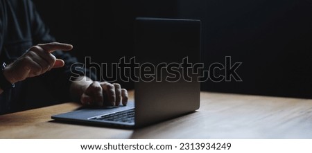Man hands and Laptop on wooden table. Copy space high quality picture. High quality photo