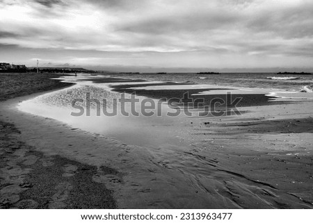 Black and white photo of the seaside of Pescara in winter, Italy