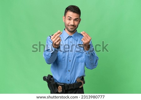 Young police caucasian man over isolated background making money gesture