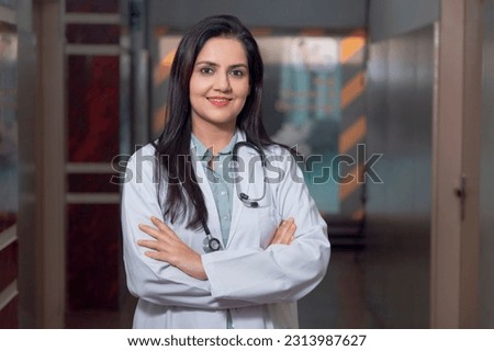 Medical concept, Indian doctor in uniform standing at hospital. Royalty-Free Stock Photo #2313987627