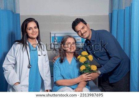 Man with flower bouquet visiting his relative and giving best wish at hospital