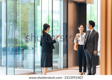 A female guide guiding a couple. Royalty-Free Stock Photo #2313992407