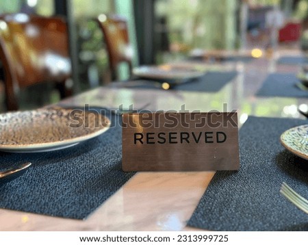 Reserved sign on a table in restaurant