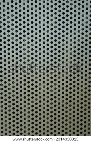 Metal cover with round holes