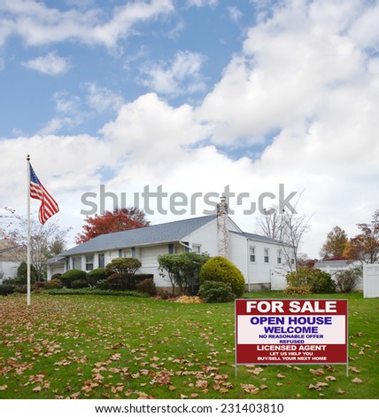 American Flag pole Real Estate For Sale Open House Welcome sign suburban ranch style home autumn day residential neighborhood blue sky clouds USA