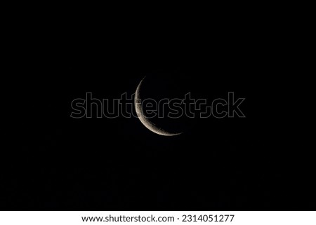 increasing moon seen in the southern hemisphere  in the dark night sky, nightscape, night full of stars Royalty-Free Stock Photo #2314051277