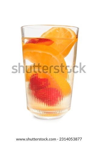 Glass of infused water with sliced strawberry and orange on white background