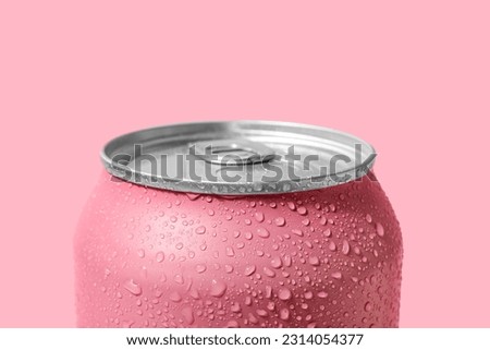 Can of fresh soda with water drops on pink background, closeup Royalty-Free Stock Photo #2314054377