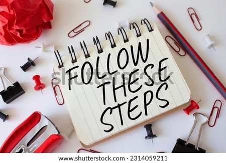 Follow these steps symbol. Concept words Follow these steps on white notebook. Beautiful white background. Business and Follow these steps concept. Copy space. Royalty-Free Stock Photo #2314059211