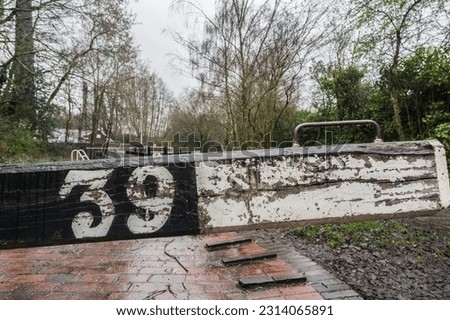 Rustic canal lock with number 39, transport and travel concept illustration.