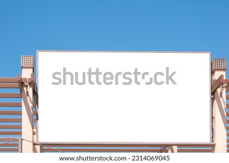 Blank white big mockup advertising sign on store, shop, shopping mall building. Empty banner mock up template outdoors