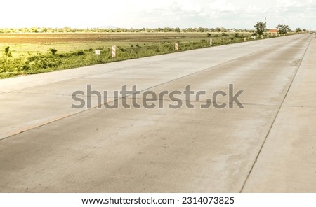 Concrete pavement road with longitudinal joint and construction joint.Empty concrete road with sunshine.. Royalty-Free Stock Photo #2314073825