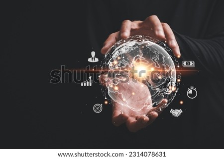 Hand grasps virtual Global Internet connection metaverse, signifying convergence of business, technology, digital marketing. It encompasses financial and banking realms, digital link tech and big data Royalty-Free Stock Photo #2314078631