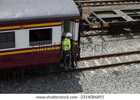 Railway engineer on the last train carriage,  Train running test and movement . Royalty-Free Stock Photo #2314086893