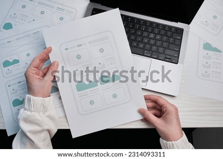 Woman designer create website design wireframe. Sketch, prototype, framework, layout future design project. UI and UX - user interface, user experience designer. Creative concept for web design studio Royalty-Free Stock Photo #2314093311