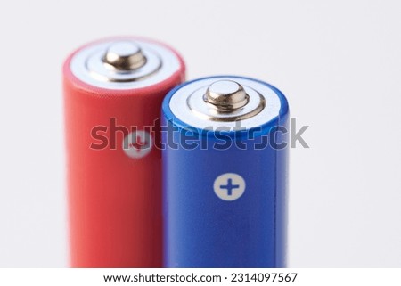Colorful alkaline AAA batteries closeup isolated on white background Royalty-Free Stock Photo #2314097567