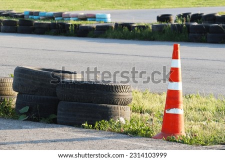 cone and tires on the race track             Royalty-Free Stock Photo #2314103999