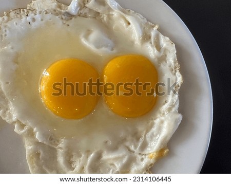 a picture of fried chicken eggs on a plate