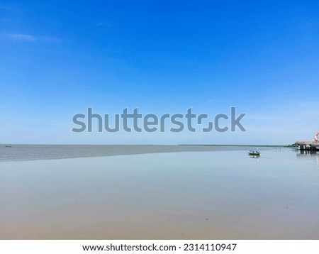 nature background.  view of the beach at low tide.  boat anchored on the shore
