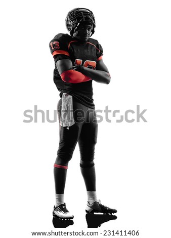 one american football player standing arms crossed in silhouette shadow on white background