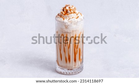 Caramel milkshake glass isolated side view