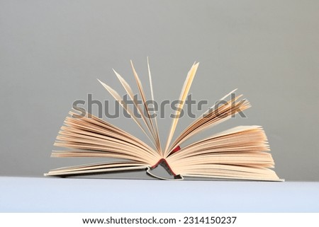 Open book on gray background