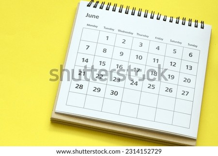 The June desk calendar on light yellow background. Royalty-Free Stock Photo #2314152729