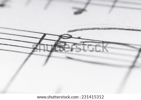 Handwritten musical notes, shallow DOF