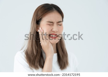 Asian woman feel toothache from gingivitis, female suffer tooth, decay problems, dental care. sensitive tooth, decay problem, bad breath, Gingival Recession, Oral Hygiene instruction, tooth extraction Royalty-Free Stock Photo #2314172195