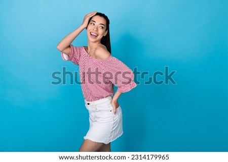 Photo model korean young girl posing preppy look empty space wear trendy outfit shopping offer outfit isolated on blue color background