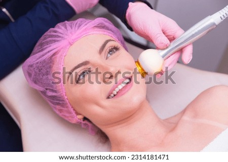 closeup photo of woman's face, photo of aesthetics, anti aging procedures. Radio frequency application. Aesthetics, spa. beautician.