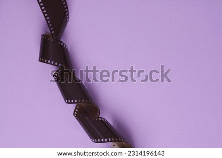Photographic film on lavender background