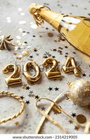 Vertical Golden color palette photo with new year 2024 numbers surrounded by confetti and decorations
