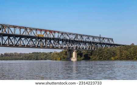 Danube Bridge or the Friendship Bridge on a sunny day. Steel truss bridge over the Danube River connecting Bulgarian and Romanian banks between Ruse and Giurgiu cities Royalty-Free Stock Photo #2314223733