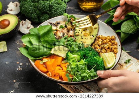 Buddha bowl, Avocado, mushrooms, broccoli spinach, chickpeas pumpkin. healthy and balanced food Top view