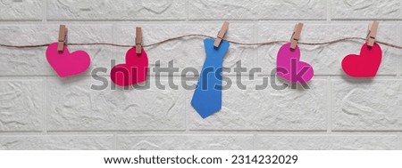 Banner with tie and hearts on rope. Father's Day gifts. Funny garland for Father's Day, birthday, bachelor party, anniversary. Preparation for holiday. Header for website, blog, article, advertisement Royalty-Free Stock Photo #2314232029