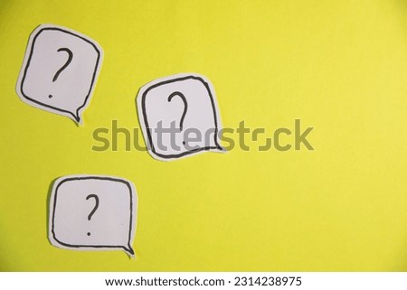 question mark on blue and yellow background