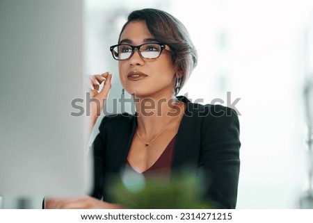 Computer, research and business woman in glasses reflection for reading, online review or editor analysis. Focused Latino person or professional worker in website editing or analytics on desktop pc