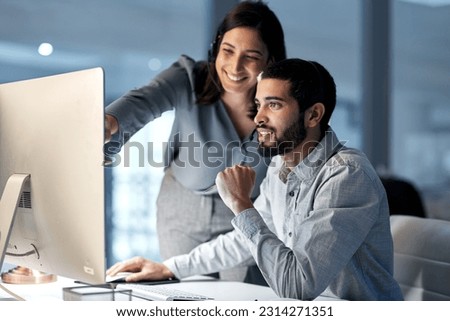 Call center, manager and telemarketing team at computer for software training, customer service and CRM in office at night. Man, woman and sales mentor helping intern on desktop for technical support Royalty-Free Stock Photo #2314271351