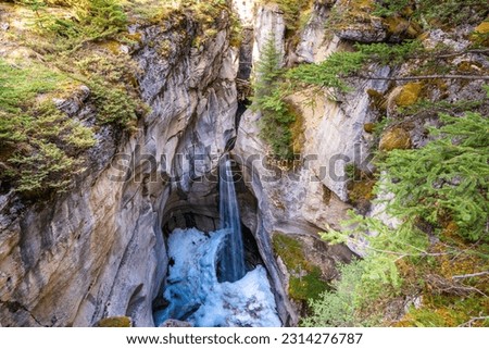 Maligne Canyon waterfall in summer. Jasper National Park, Alberta, Canada. Royalty-Free Stock Photo #2314276787