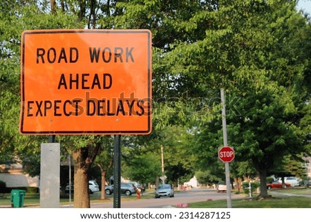 Road work ahead expect  Delays oad sign telling motorists to be alert as they are entering a contruction  suburb area.