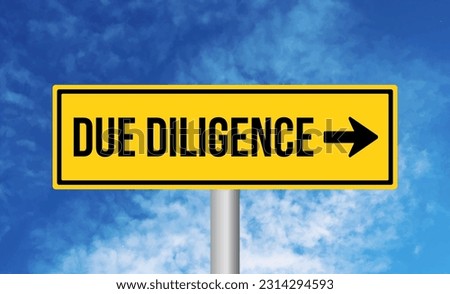 Due diligence road sign on blue sky background Royalty-Free Stock Photo #2314294593