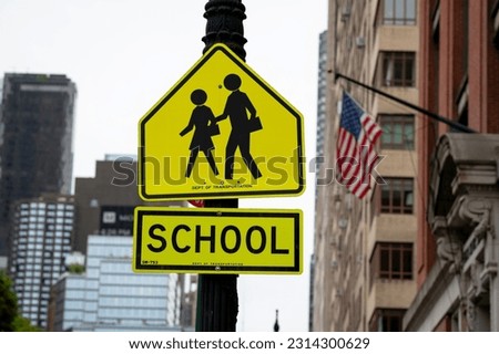 School Crosswalk Ahead Traffic Sign in a Road in New York
