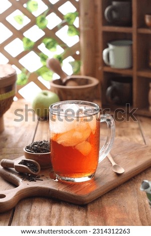 Sweet iced tea on the wooden table