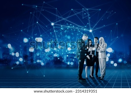 Diverse business people communicating and discussing work over futuristic technology background