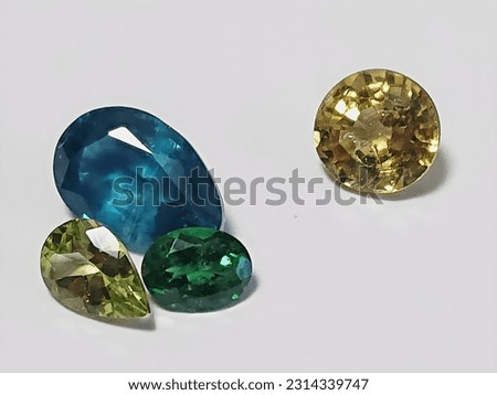 Kyanite and marie garnet, peridot and tsavorite. Recommended when you want to use an image of a jewel. Royalty-Free Stock Photo #2314339747